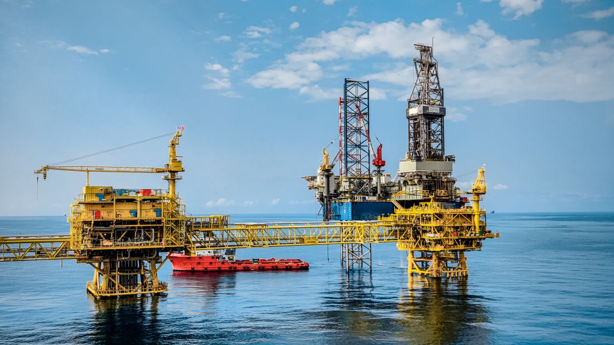 Offshore oil production platform and drilling rig on open water