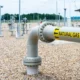 A gas pipe with label "Natural Gas" running across the ground