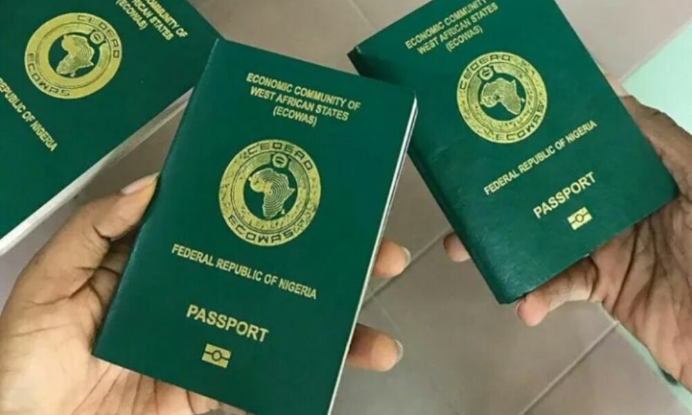An overhead view of handheld Nigerian passports