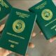 An overhead view of handheld Nigerian passports