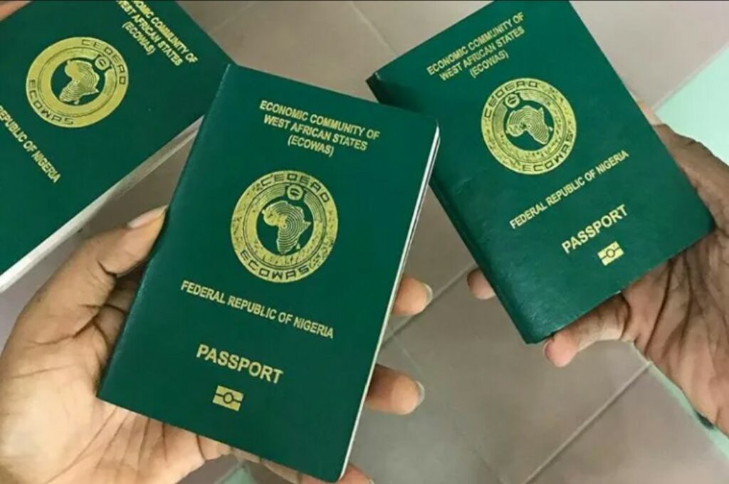 An overhead view of handheld Nigerian passports