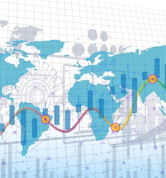 World map overlaid with financial market charts illustrating sovereign debt
